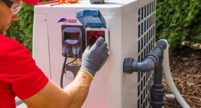 HVAC Repair Technician Working on AC Unit in Delaware County